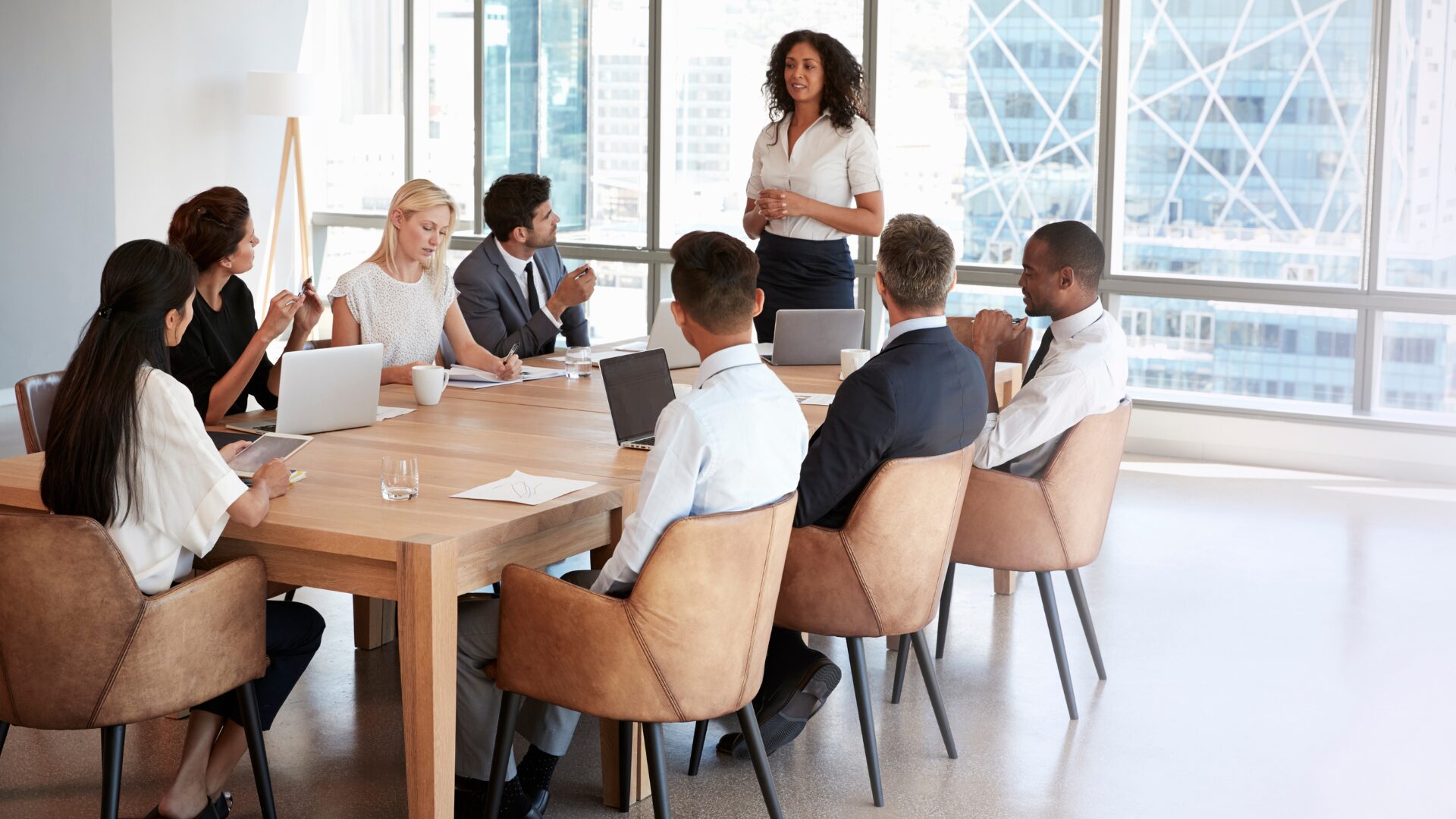 people sitting around a table having a meeting
