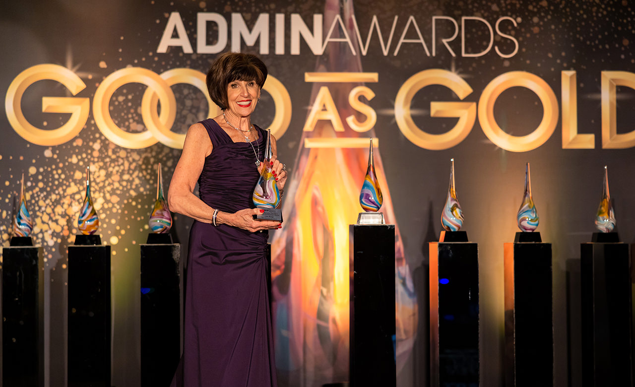 Joan Burge winning the Jeannette Castellano Lifetime Achievement Award at the 2023 Admin Awards.