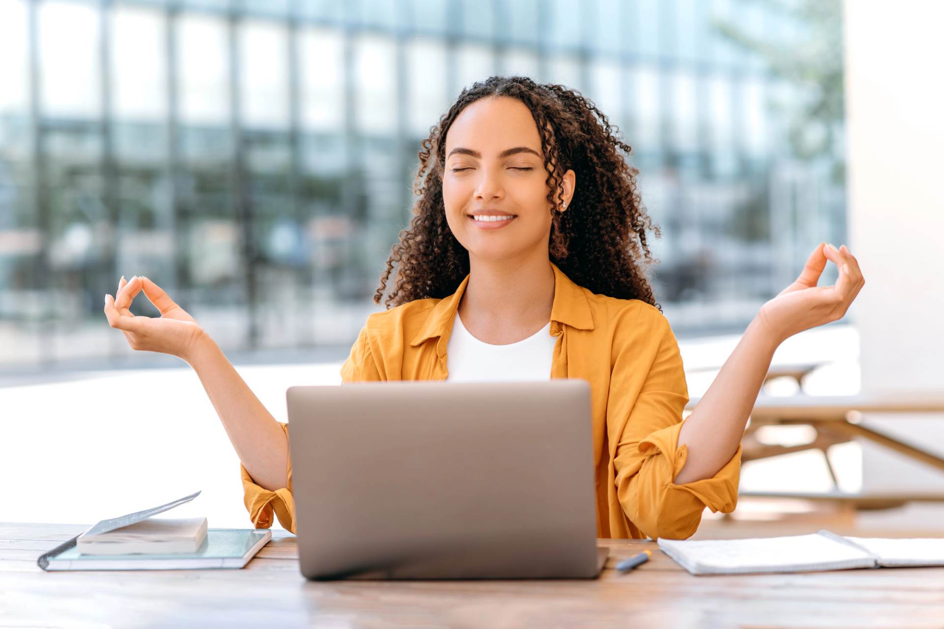 Administrative Professional practicing self-care at her desk
